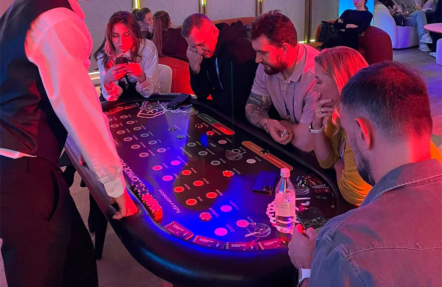 Guests socializing around a themed entertainment table