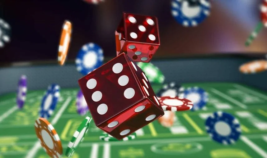 Elegant casino-style event table with cards and chips under warm evening lighting