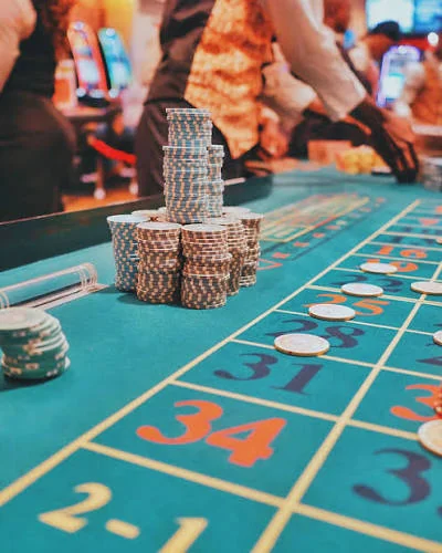 Private party guests enjoying casino-style entertainment tables